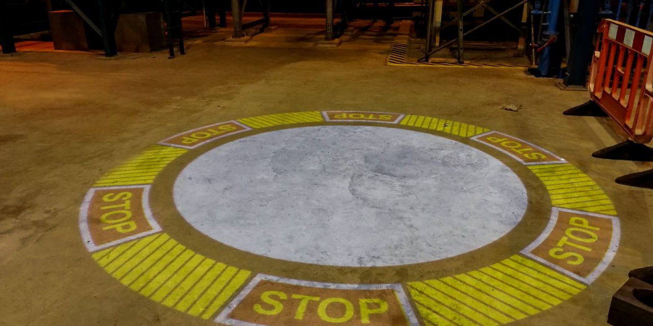 Leading crane service company improves workplace safety with projected signage